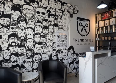 Interior of Trend Style Gents Salon in Dubai, featuring unique wall art and reception area.