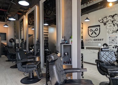 Modern interior of Trend Style Gents Salon in Dubai, Dubai, AE with stylish black barber chairs.