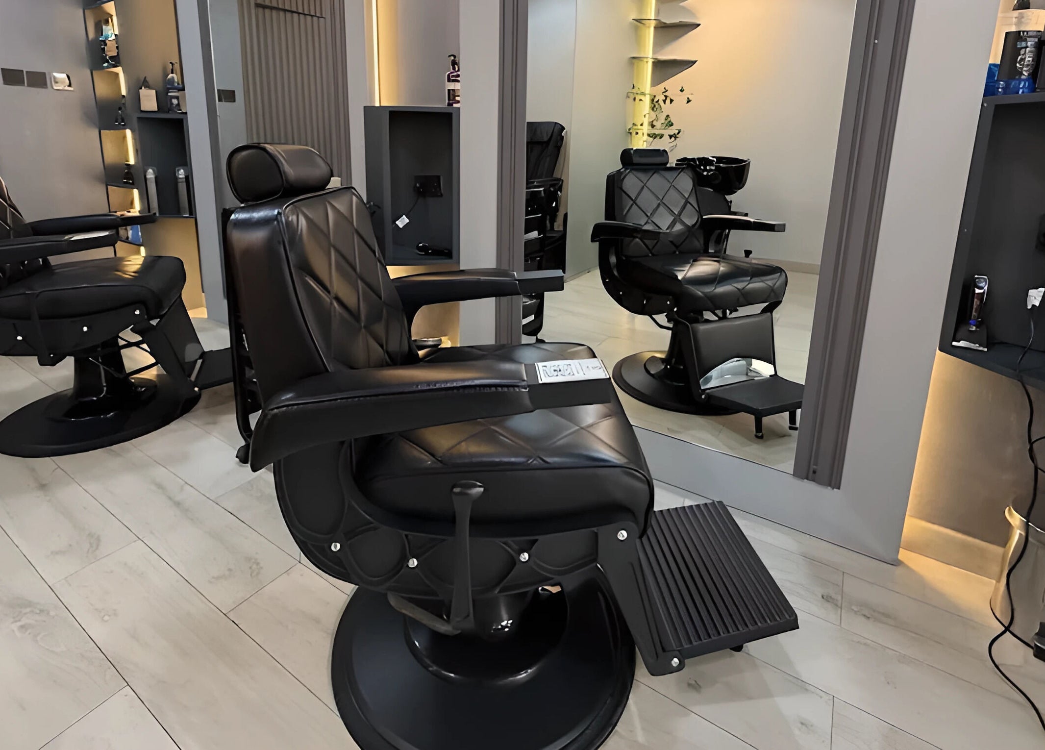 Luxurious black barber chairs at Trend Style Gents Salon, Dubai, Dubai, AE, ready for customer comfort.