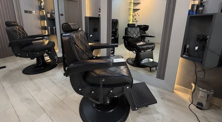 Luxurious black barber chairs at Trend Style Gents Salon, Dubai, Dubai, AE, ready for customer comfort.