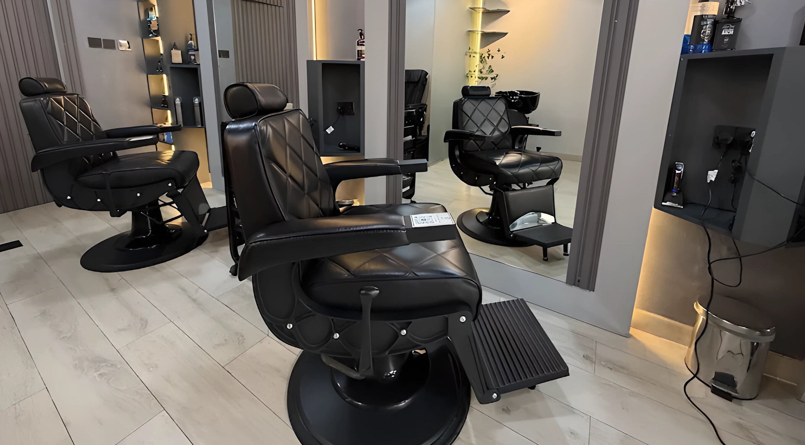 Luxurious black barber chairs at Trend Style Gents Salon, Dubai, Dubai, AE, ready for customer comfort.