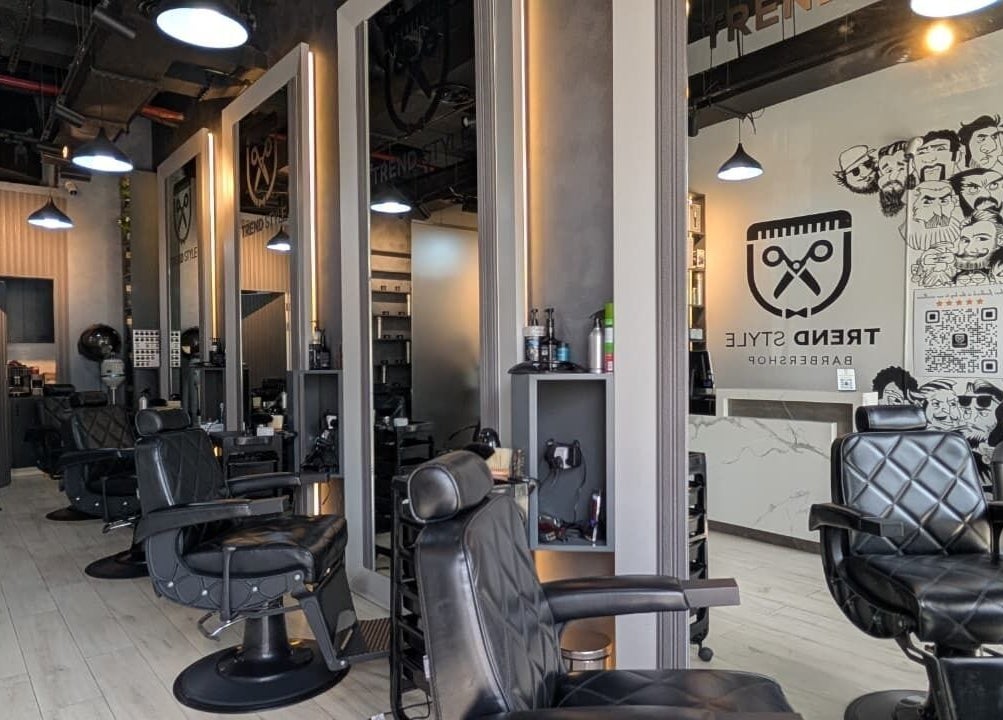 Trendy interior of Trend Style Gents Salon in Dubai, Dubai, AE, featuring stylish barber chairs and modern decor.
