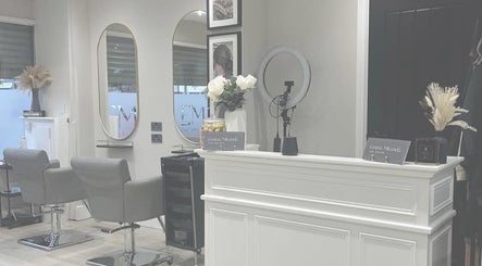Elegant interior of Elle Rochford hair in Whiston, England, GB with modern chairs and decor.