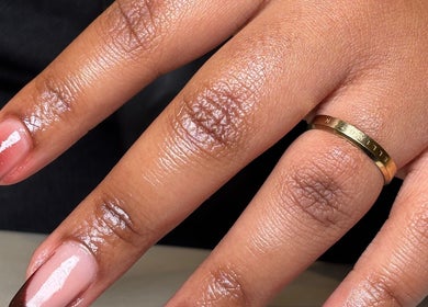 Close-up of elegant manicured nails with gold leaf detail at Dk co., Sandton, Gauteng, ZA.