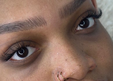 Close-up of woman with beautifully groomed eyebrows and lashes at Dk Co., Johannesburg, Gauteng, ZA.