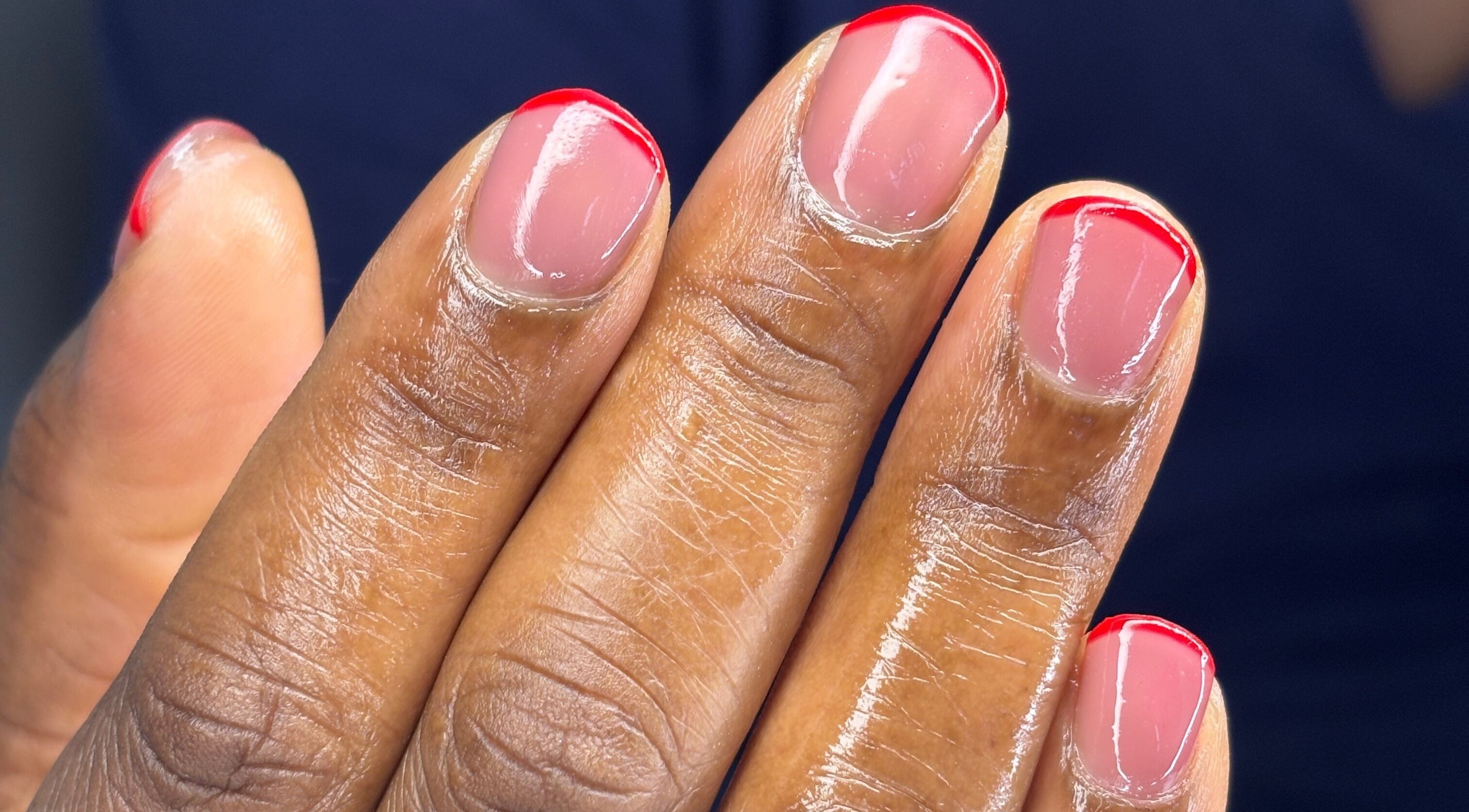 Elegant red-tipped manicure at Nail Diaries Studio, Sandton, Gauteng, ZA. Perfectly polished nails.