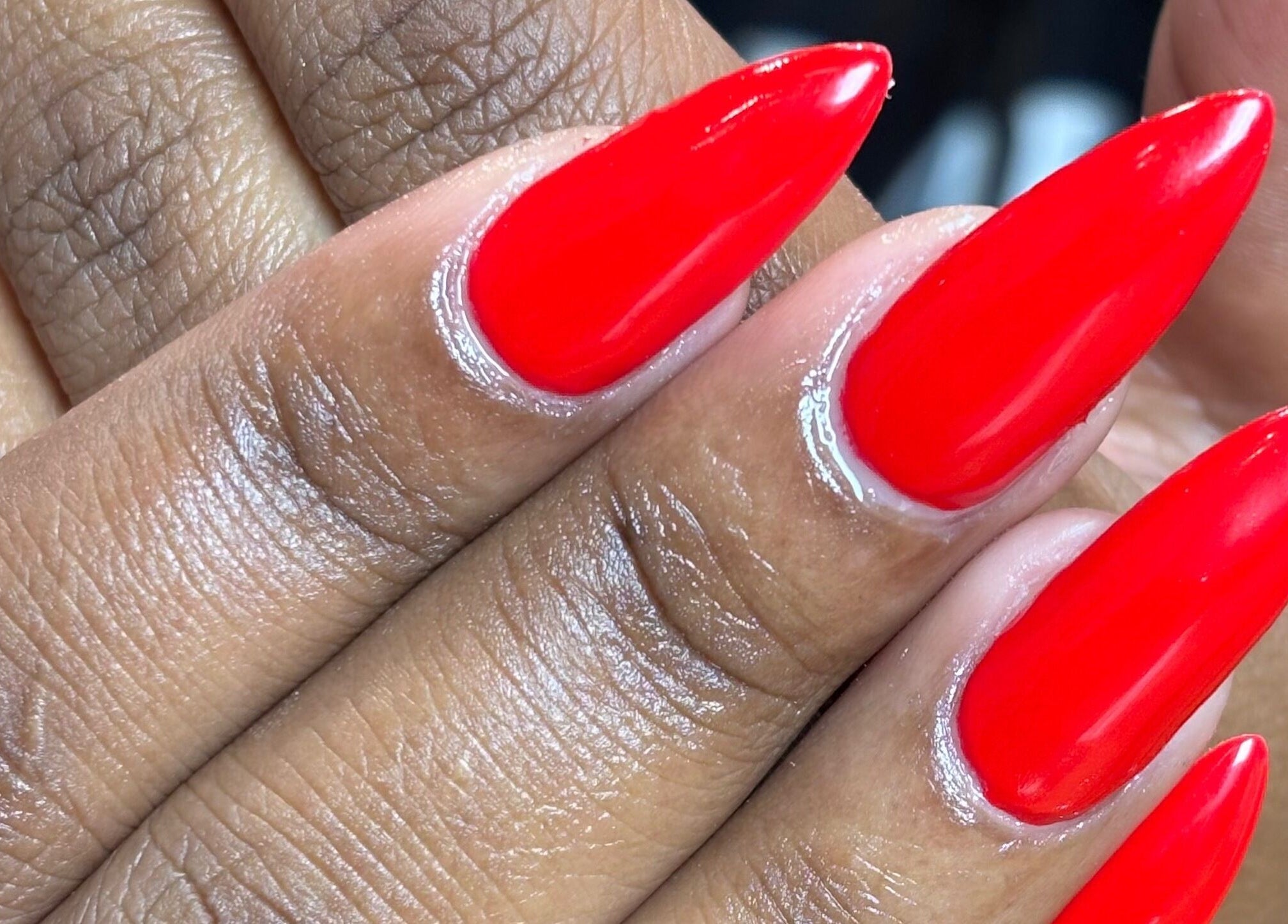 Bright red manicure at Nail Diaries Studio, Sandton, Gauteng, ZA, showcasing flawless nail artistry.