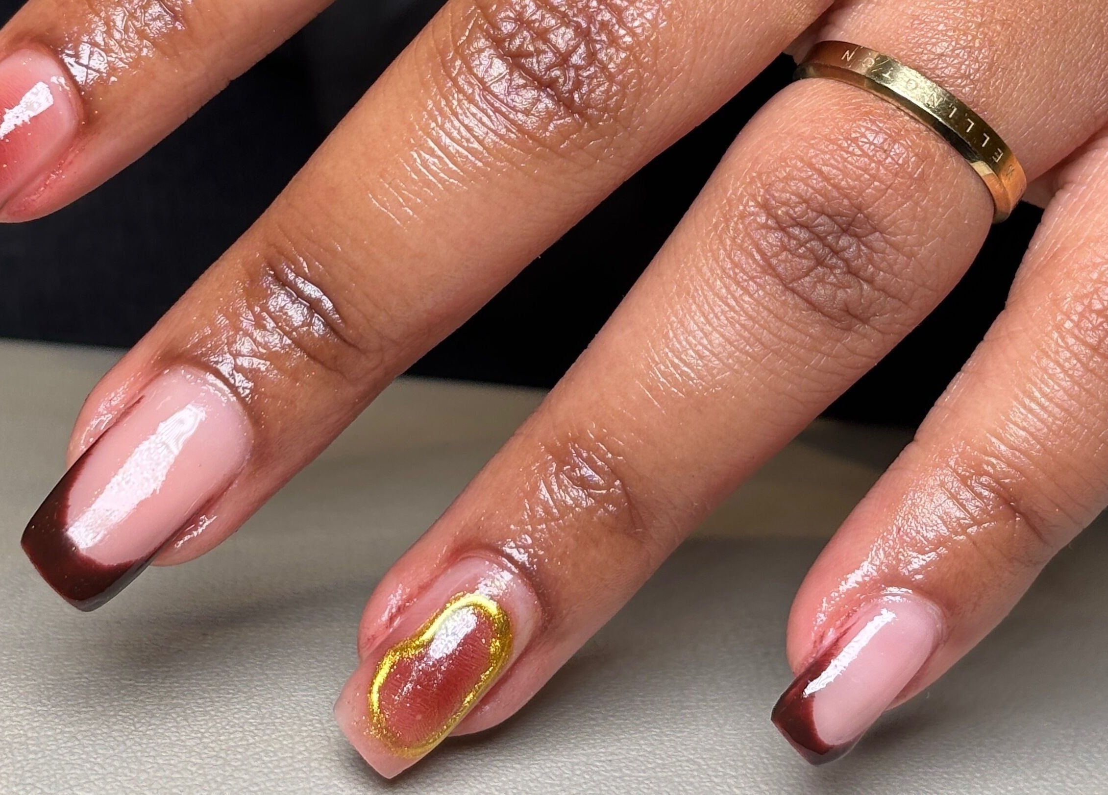 Elegant manicure with golden leaf detail at Nail Diaries Studio, Sandton, Gauteng, ZA.