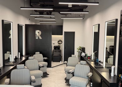 Sleek interior of Razorlane Gents Salon L.L.C, Dubai, Dubai, AE, showcasing stylish barber chairs and products.