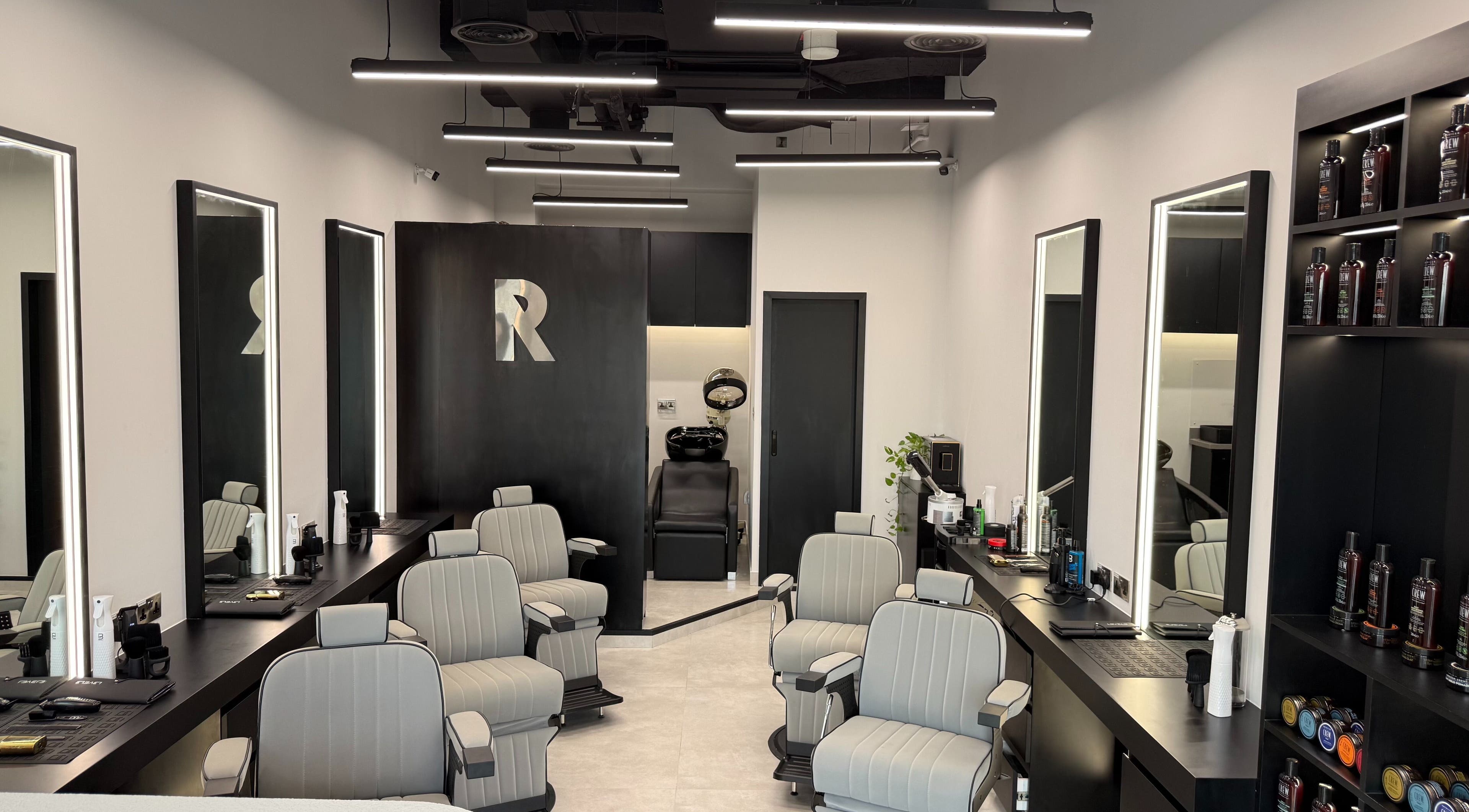 Sleek interior of Razorlane Gents Salon L.L.C, Dubai, Dubai, AE, showcasing stylish barber chairs and products.