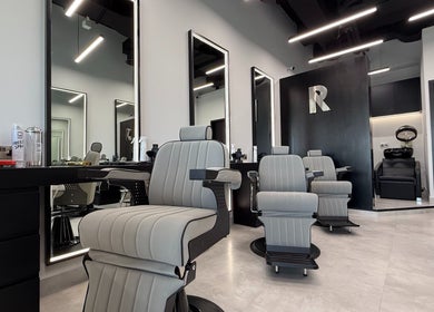 Modern interior of Razorlane Gents Salon L.L.C in Dubai, AE showcasing sleek barber chairs and stylish decor.