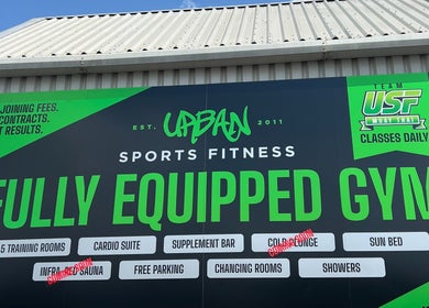 Urban Sports Fitness signboard at Royal Leamington Spa, England, highlighting facilities.