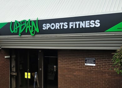Entrance of Urban Sports Fitness at Royal Leamington Spa, England, GB with bold signage.