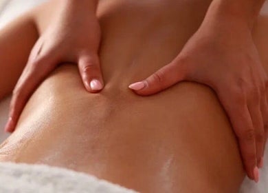 Relaxing massage at Hellen Passinato Massage Therapist in London, GB, showcasing expert hands on a client's back.