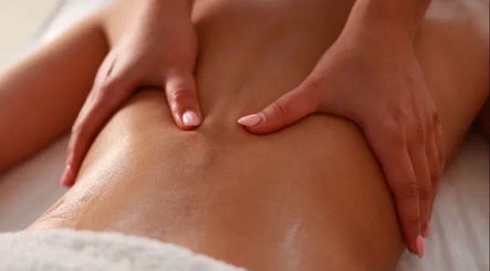 Relaxing massage at Hellen Passinato Massage Therapist in London, GB, showcasing expert hands on a client's back.
