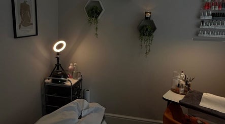 Cozy treatment room at Mills Beauty in Oxenholme, England. Soft lighting and elegant decor create a serene environment.