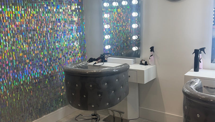 Chic styling station at Paula & Zoe Hairdressing, Banchory, Scotland, GB with illuminated mirrors and holographic decor.