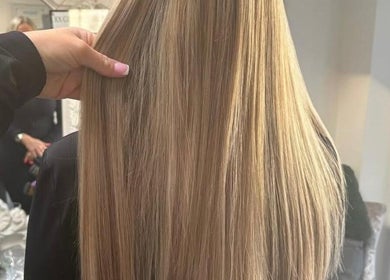 Smooth blonde hair styled at Hairbydlg, Dartford, GB, showcasing sleek salon perfection.