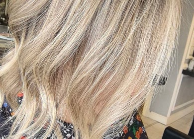 Blonde wavy hairstyle at Color Hub Salon in Cape Town, Western Cape, ZA.