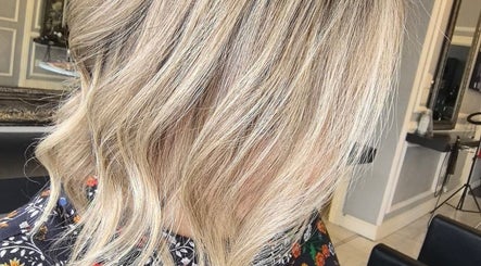 Blonde wavy hairstyle at Color Hub Salon in Cape Town, Western Cape, ZA.