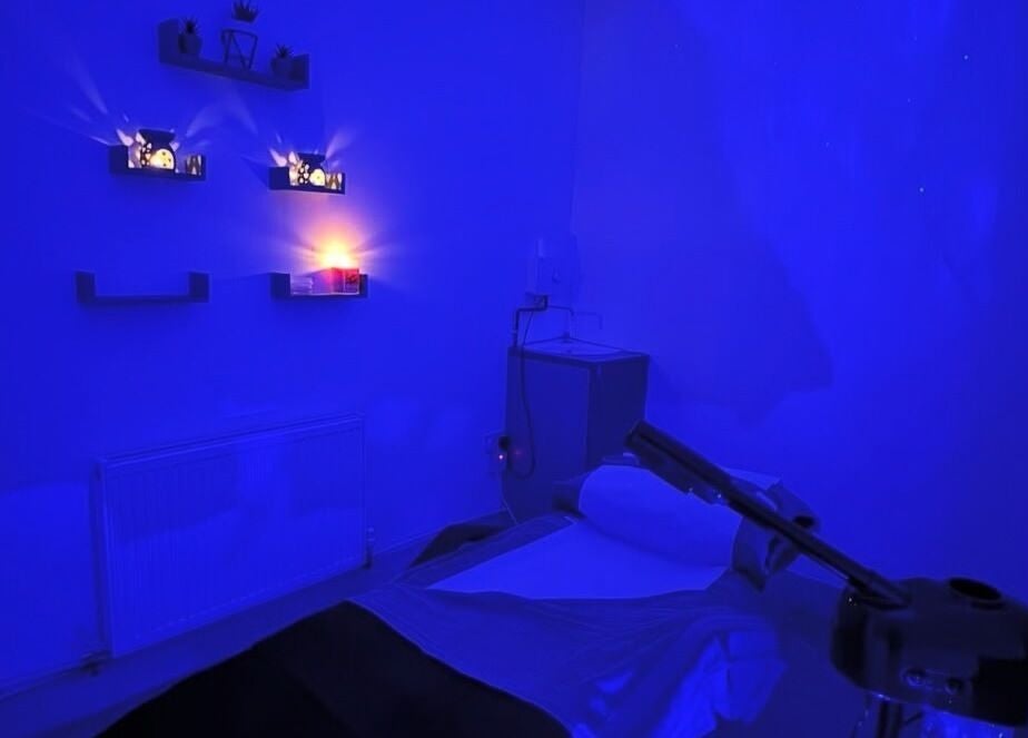 Calming treatment room with soft blue lighting at PD Beauty Lounge, Bolton, England, GB.