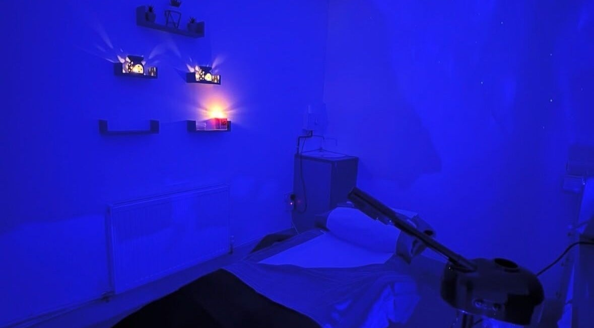 Calming treatment room with soft blue lighting at PD Beauty Lounge, Bolton, England, GB.