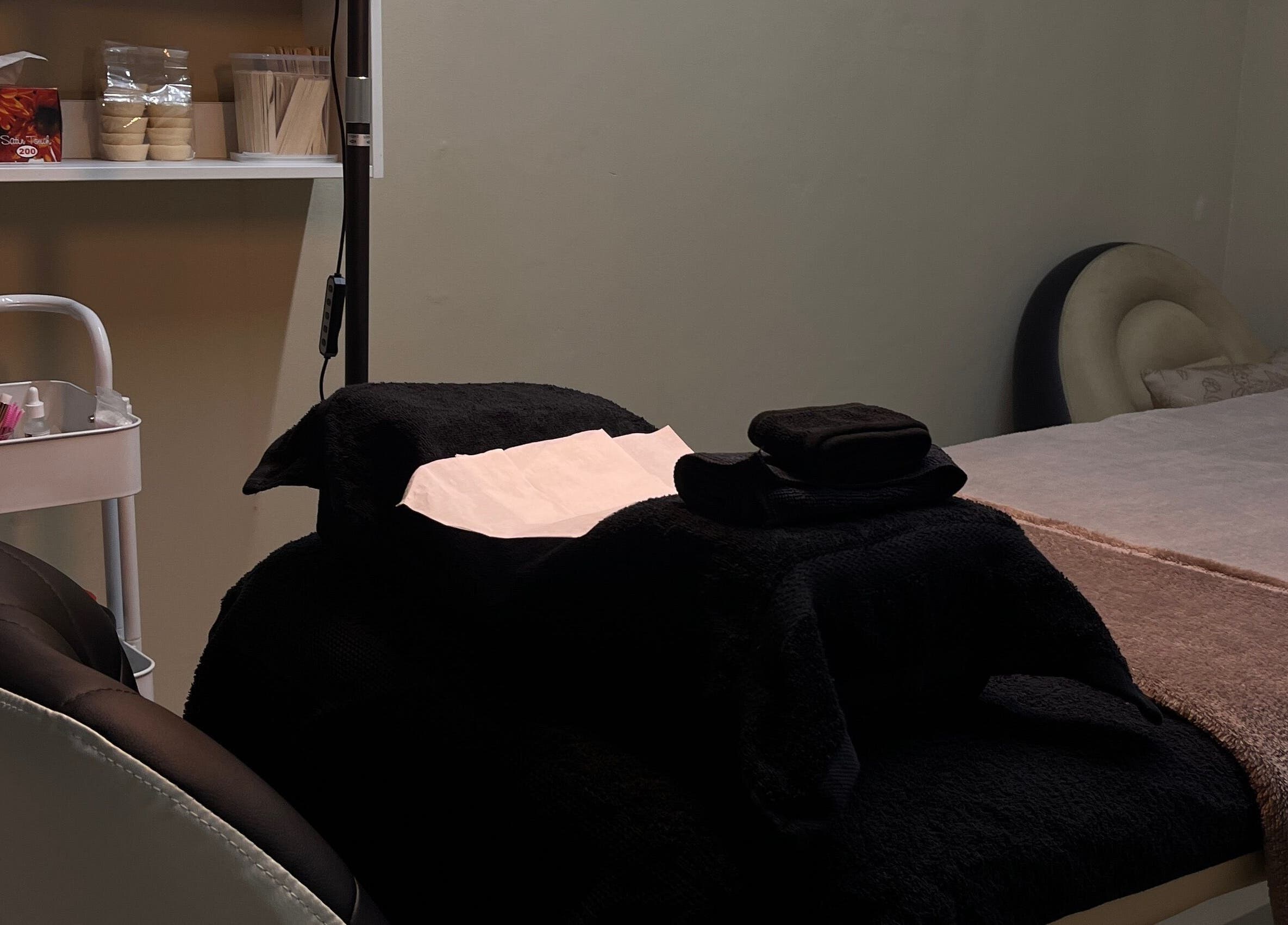 Relaxing treatment room at Made Seven, Othongathi, Kwazulu-natal, ZA, with a cozy bed and wellness tools.