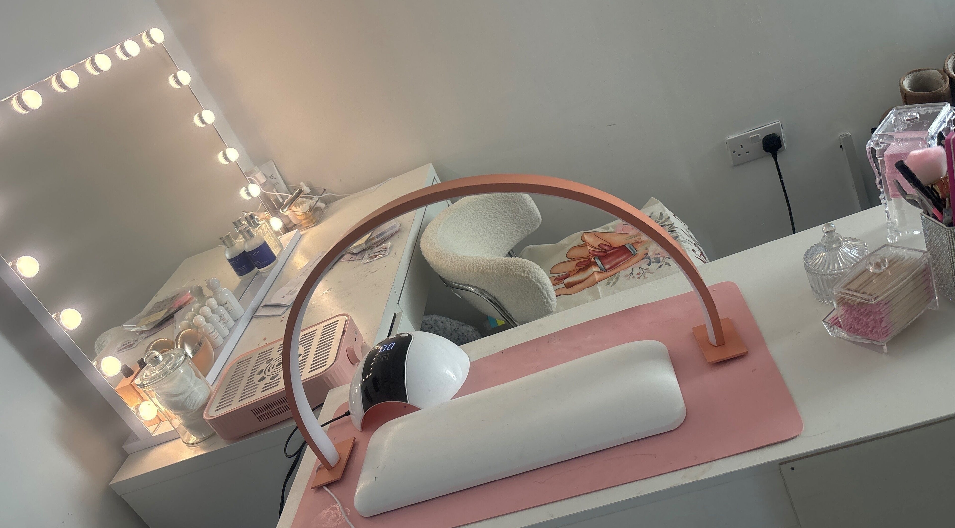 Well-lit manicure station at Nails by ells, Forest Row, England, GB showcasing nail care products and decor.