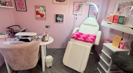 Elegant beauty room at MK Beauty Hut, Coleraine, Northern Ireland, GB, with a comfy chair and vibrant decor.