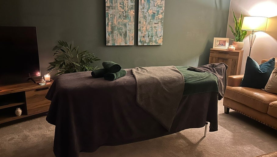 Relaxing massage room at Millward Massage Therapy, Telford, England, GB, with ambient lighting and decor.