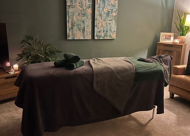 Relaxing massage room at Millward Massage Therapy, Telford, England, GB, with ambient lighting and decor.