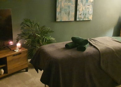Cozy therapy room at Millward Massage Therapy, Telford, England, GB with candles and serene ambiance.