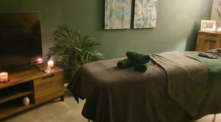 Cozy therapy room at Millward Massage Therapy, Telford, England, GB with candles and serene ambiance.