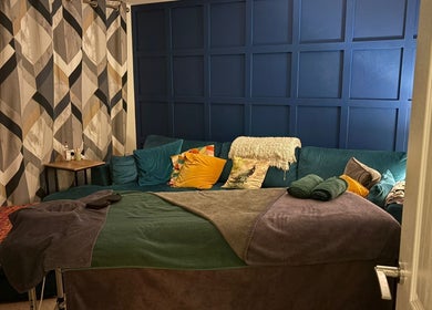 Serene massage room at Millward Massage Therapy, Telford, England, GB, showcasing cozy decor and calming ambiance.