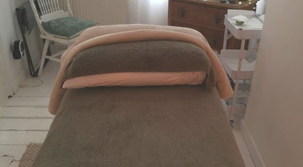 Relaxing massage table at White Dove Holistic Therapies, Bideford, England, GB. Experience ultimate tranquility.