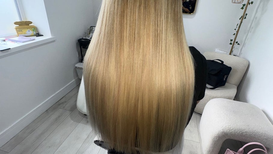 Elegant long blonde hair styling at PrincessStrands, Wakefield, England, GB.