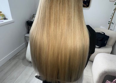 Elegant long blonde hair styling at PrincessStrands, Wakefield, England, GB.