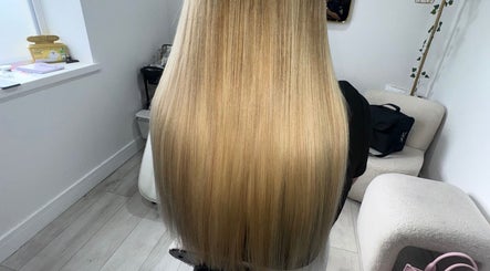 Elegant long blonde hair styling at PrincessStrands, Wakefield, England, GB.
