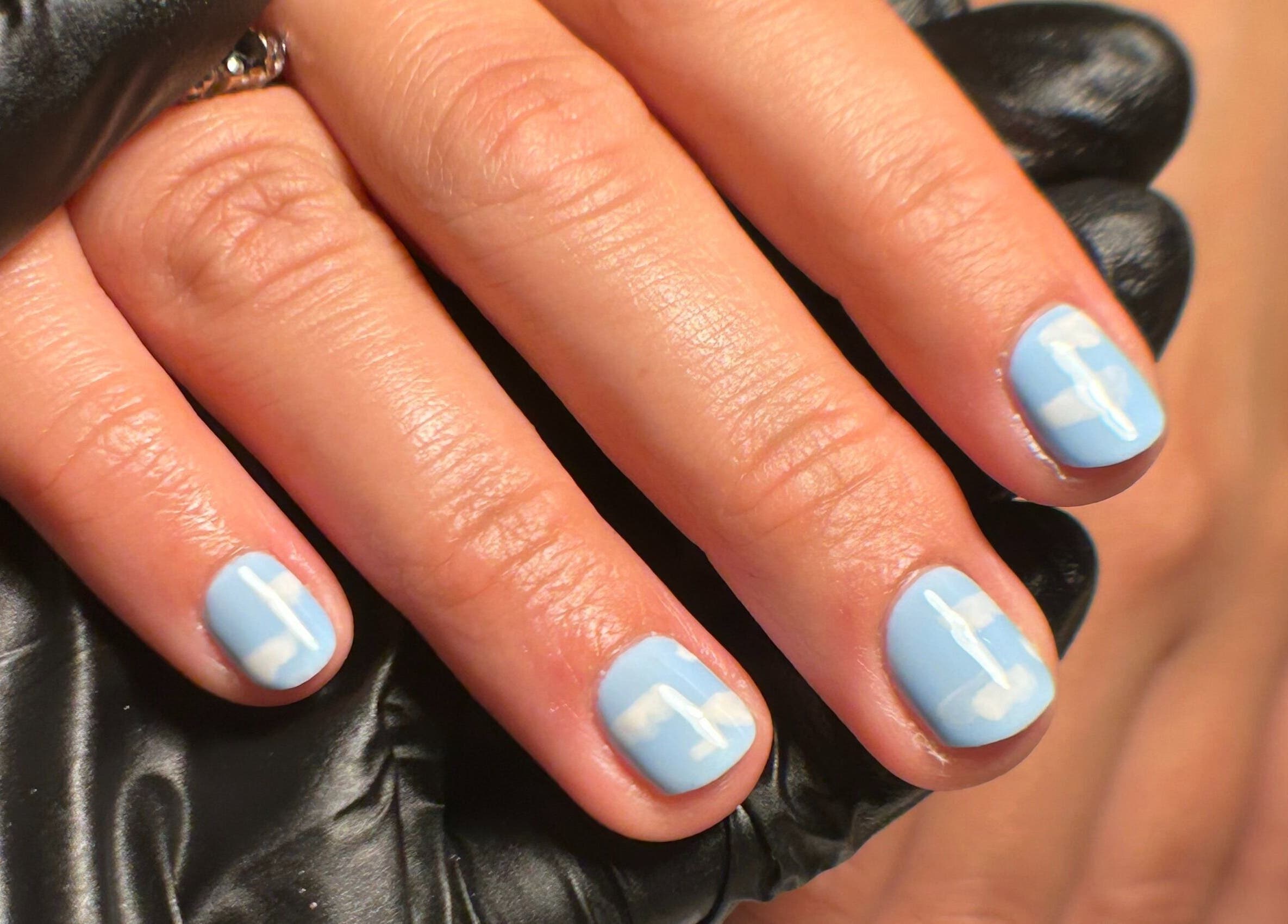 Light blue nail art with white clouds at My Nail Muse, Sheffield, England, GB.