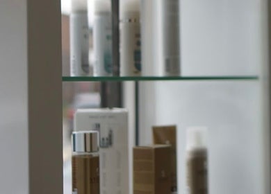 Curly Life London offers premium hair products displayed elegantly on glass shelves in London, England, GB.