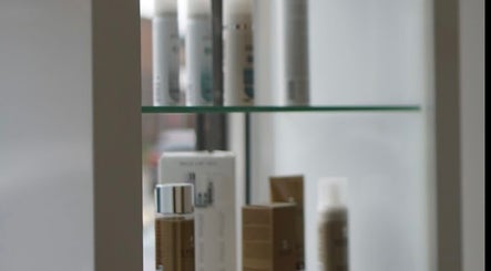 Curly Life London offers premium hair products displayed elegantly on glass shelves in London, England, GB.