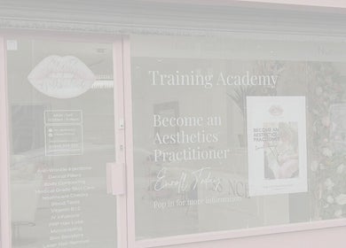 HB Aesthetics # DC Beauty front window display at Sutton, England, GB showcasing training academy details.
