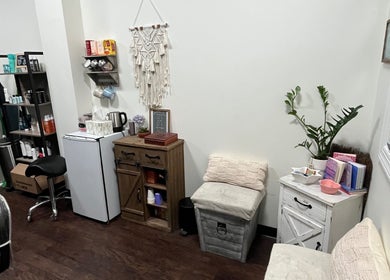 Chic interior of Hair by Micaela Rae, East Meadow, New York, US showcasing a cozy, well-lit corner with decor.