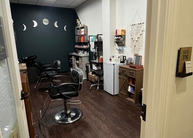 Modern salon interior of Hair by Micaela Rae in East Meadow, New York, US, featuring stylish chairs and decor.