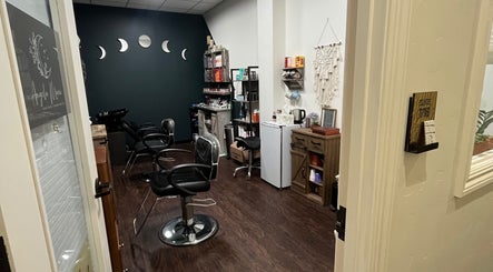 Modern salon interior of Hair by Micaela Rae in East Meadow, New York, US, featuring stylish chairs and decor.