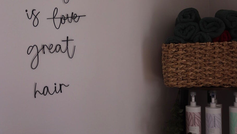 Stylish salon wall and products at Bethany Karol Hair & Nail Artistry, Bury St Edmunds, England, GB.