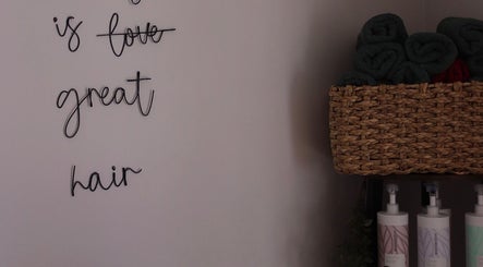 Stylish salon wall and products at Bethany Karol Hair & Nail Artistry, Bury St Edmunds, England, GB.