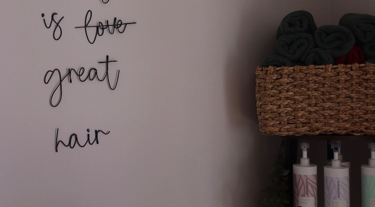 Inspirational wall art and soft towels at Bethany Karol Hair & Nail Artistry, Bury St Edmunds, England, GB.