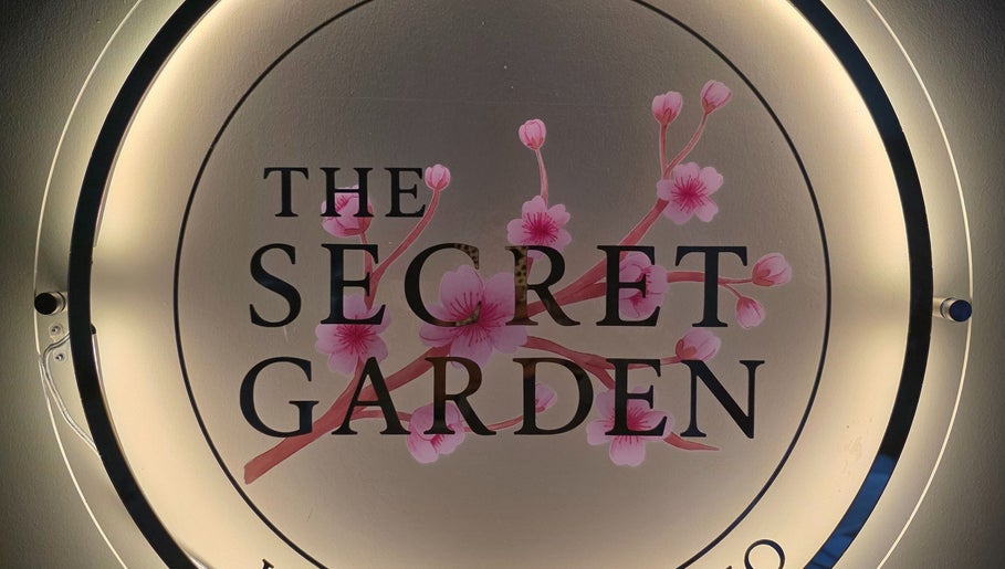 Illuminated logo of The Secret Garden Wellness Studio, Randalstown, Northern Ireland with cherry blossoms.