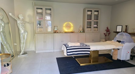 Elegant room in The Secret Garden Wellness Studio, Randalstown, Northern Ireland, GB featuring a massage table.